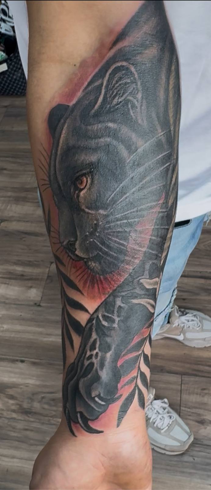 Black and grey panther realism leg sleeve tattoo by Marcelo Tattoos Bronx NY