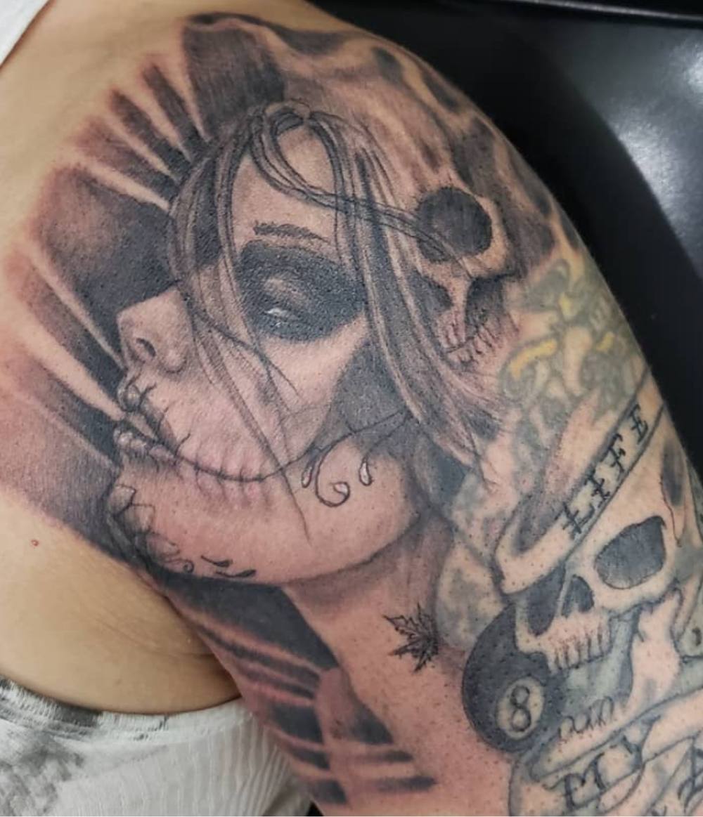 Day of the dead woman shoulder tattoo by Marcelo Tattoos Bronx NY