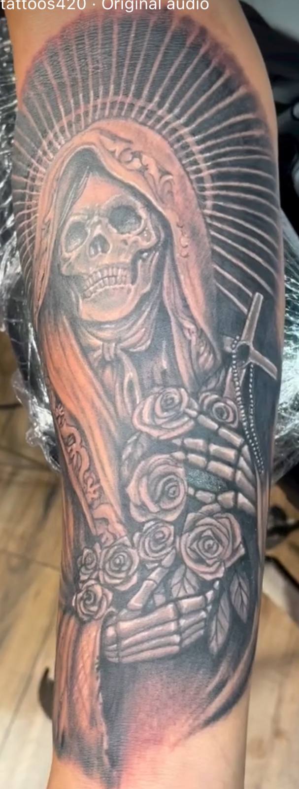 Santa Muerte with roses realism tattoo by Marcelo Tattoos Bronx NY